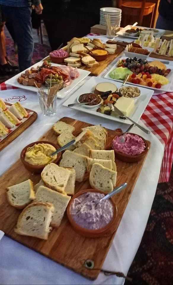 Ronni's function spread with bread boards, dips, charcuterie and antipasto platters