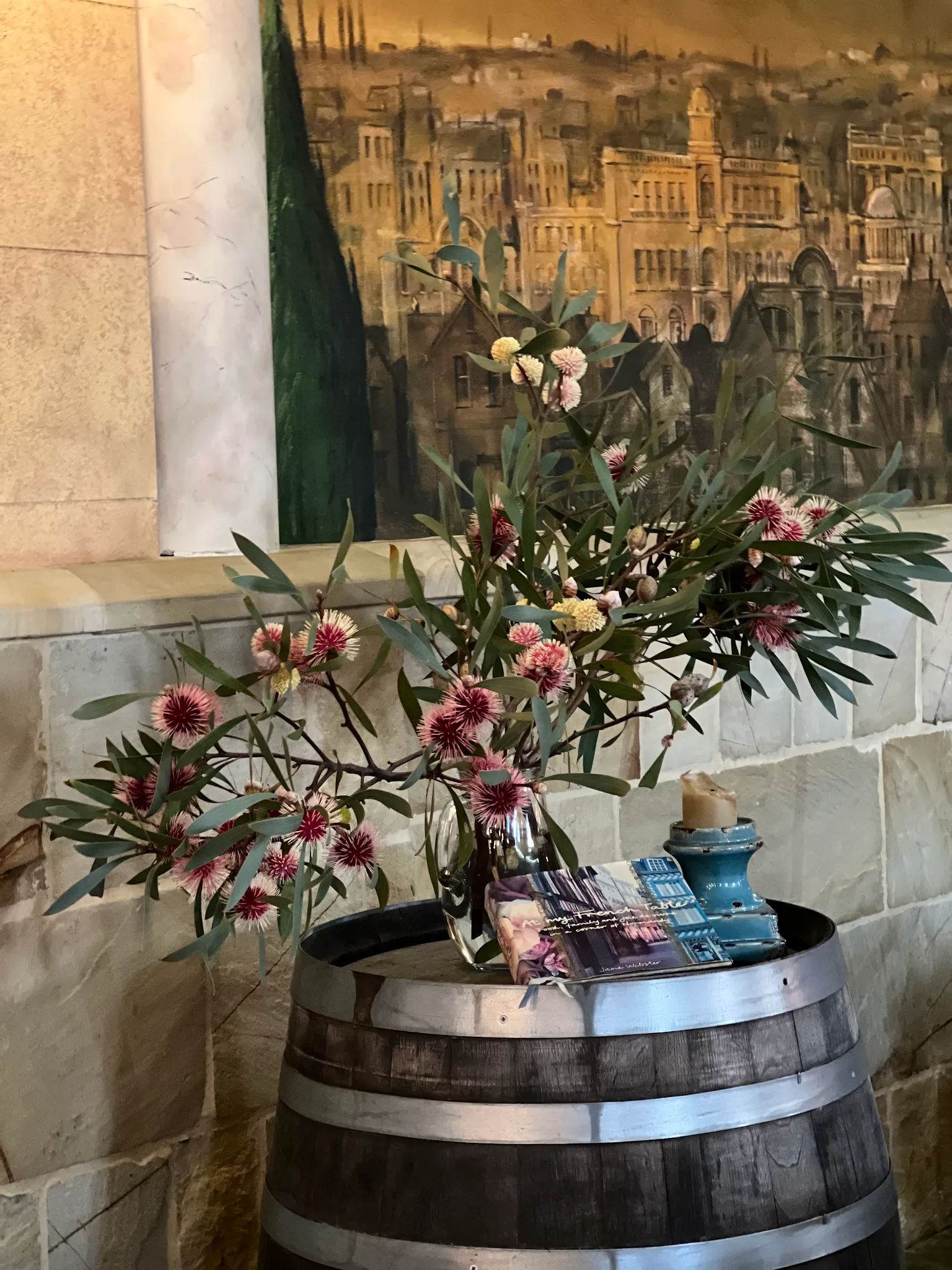 Wine barrel with native Australian flowers and Italian cityscape mural at Ronni's Restaurant